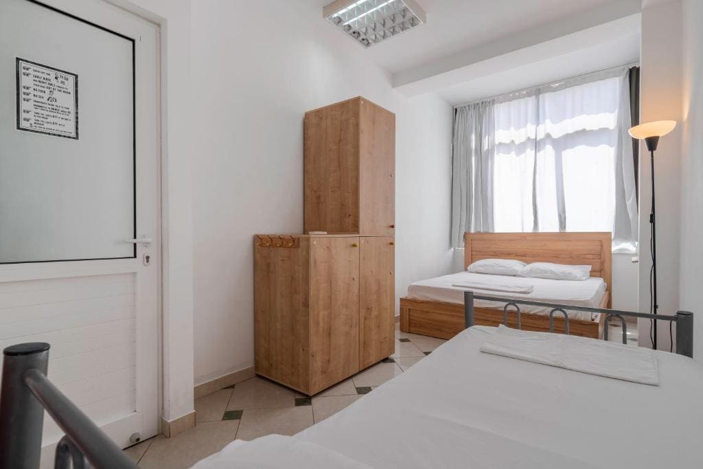 Economy Triple Room with Shared Bathroom room - Image 1