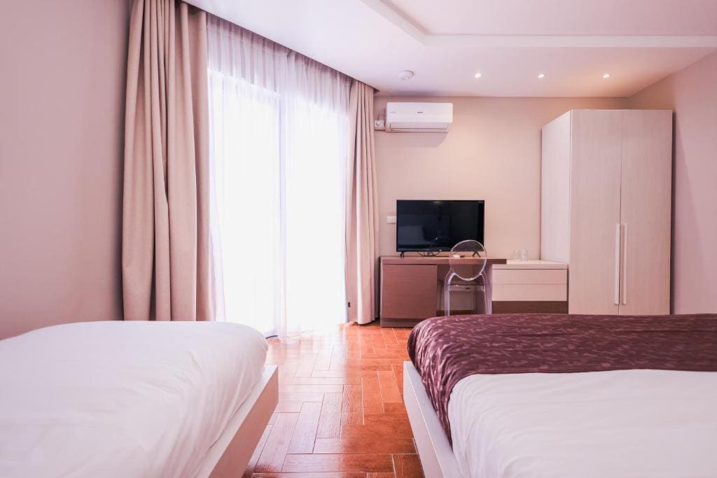 Superior Triple Room with Balcony and Side Sea View room - Image 1