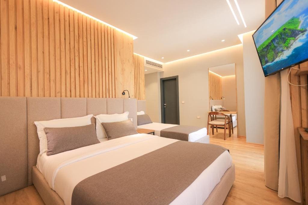 Deluxe Triple Room with Side Sea View room - Image 2
