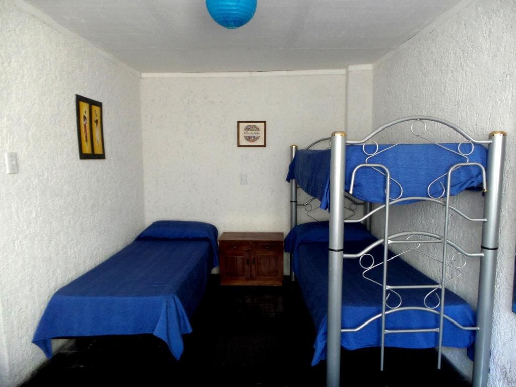 Quadruple Room with Private Bathroom room - Image 1