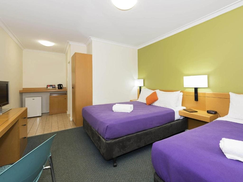 Standard Room with One Queen Bed and One Single Bed room - Image 1