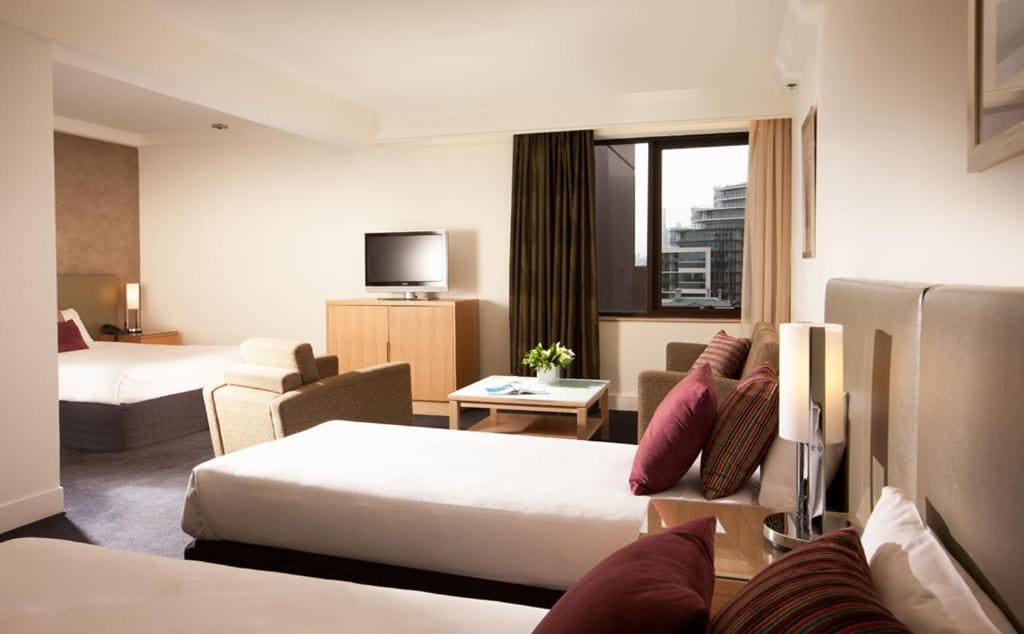 Premium Family Room with Queen and Two Single Beds room - Image 1