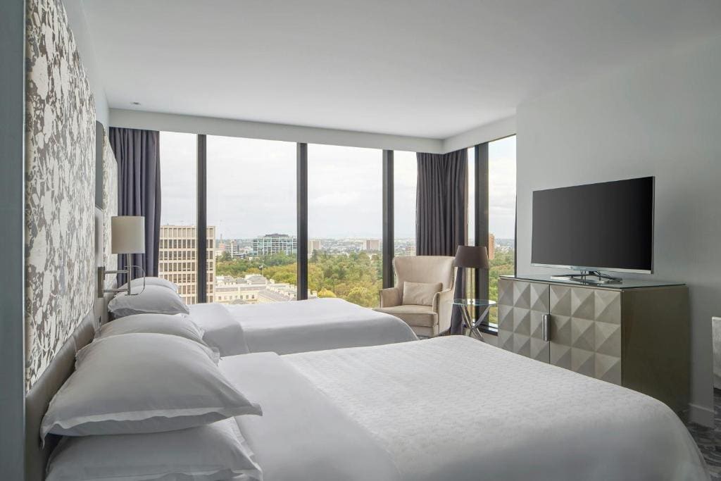 Grand Deluxe Larger Room with Two Double Beds and Garden View - Corner Room room - Image 1