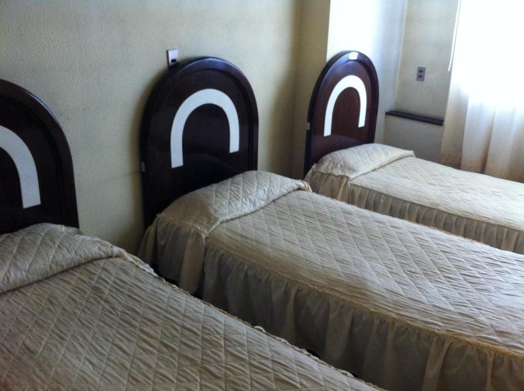 Economy Triple Room with Shared Bathroom room - Image 1