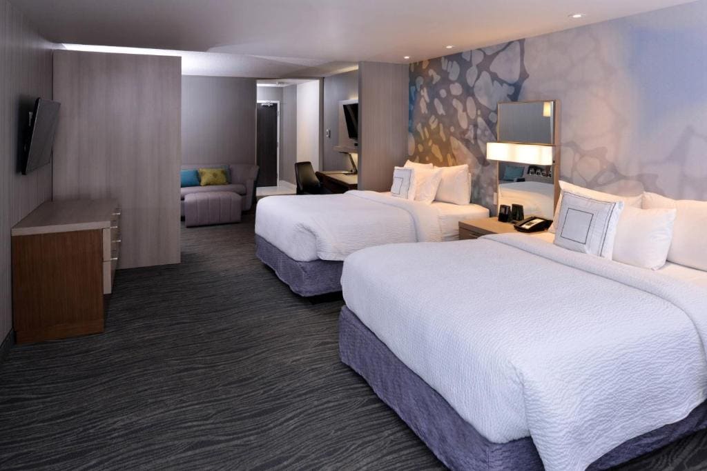 Queen Suite with Two Queen Beds and Sofa Bed room - Image 1