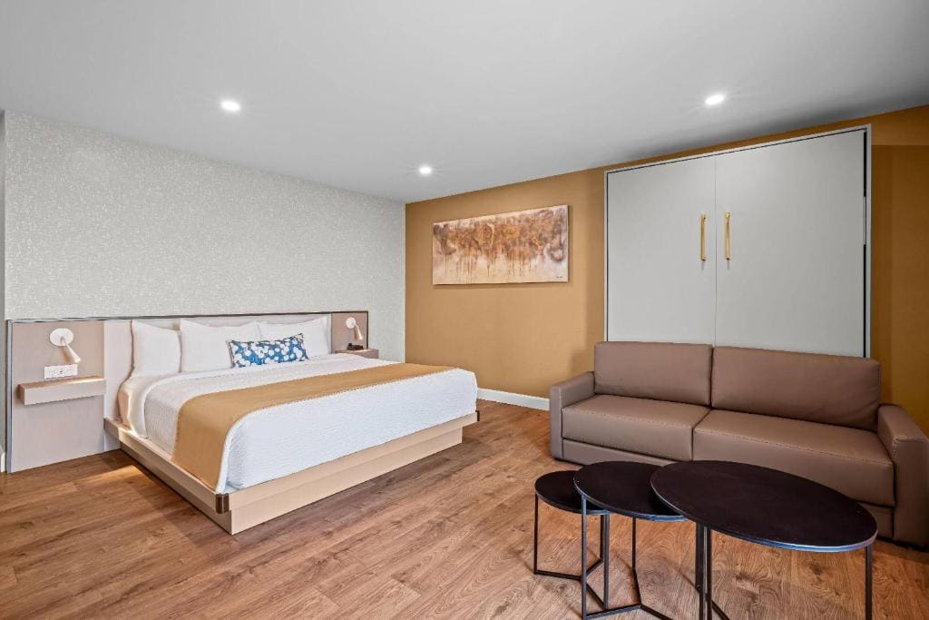 Room with One King Bed and One Queen Murphy Bed, Balcony - Non-Smoking room - Image 2