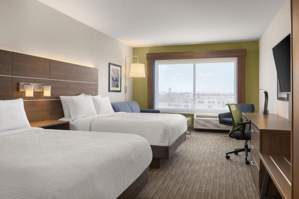 Queen Suite with Two Queen Beds and Sofa Bed room - Image 1