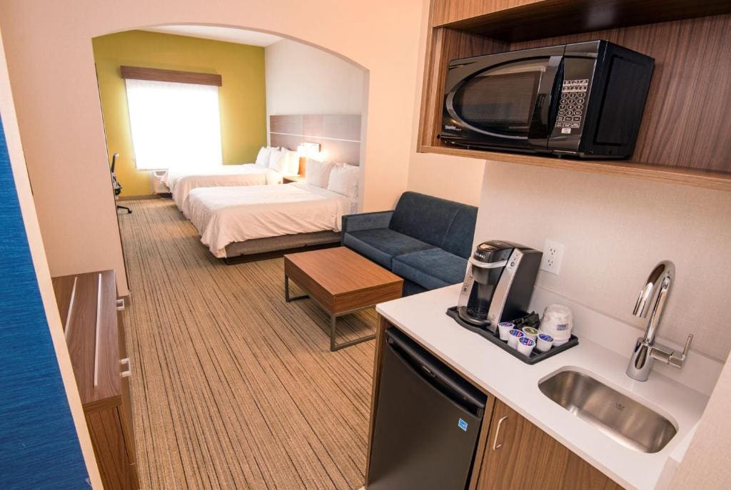 Queen Suite with Two Queen Beds and Sofa Bed room - Image 1