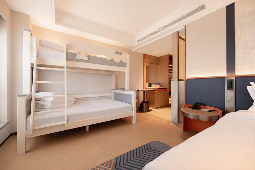 Standard Room with One King Bed and One Bunk Bed with Extra Floor Space room - Image 1