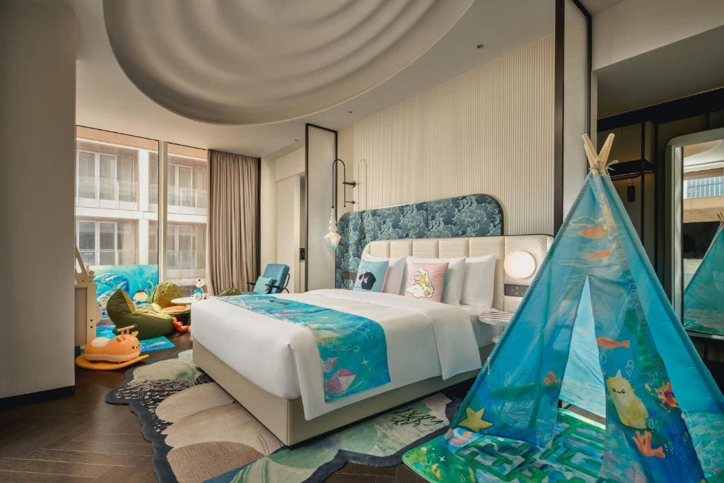 Family Premium Room with One King Bed, One Bunk Bed, and Balcony room - Image 2
