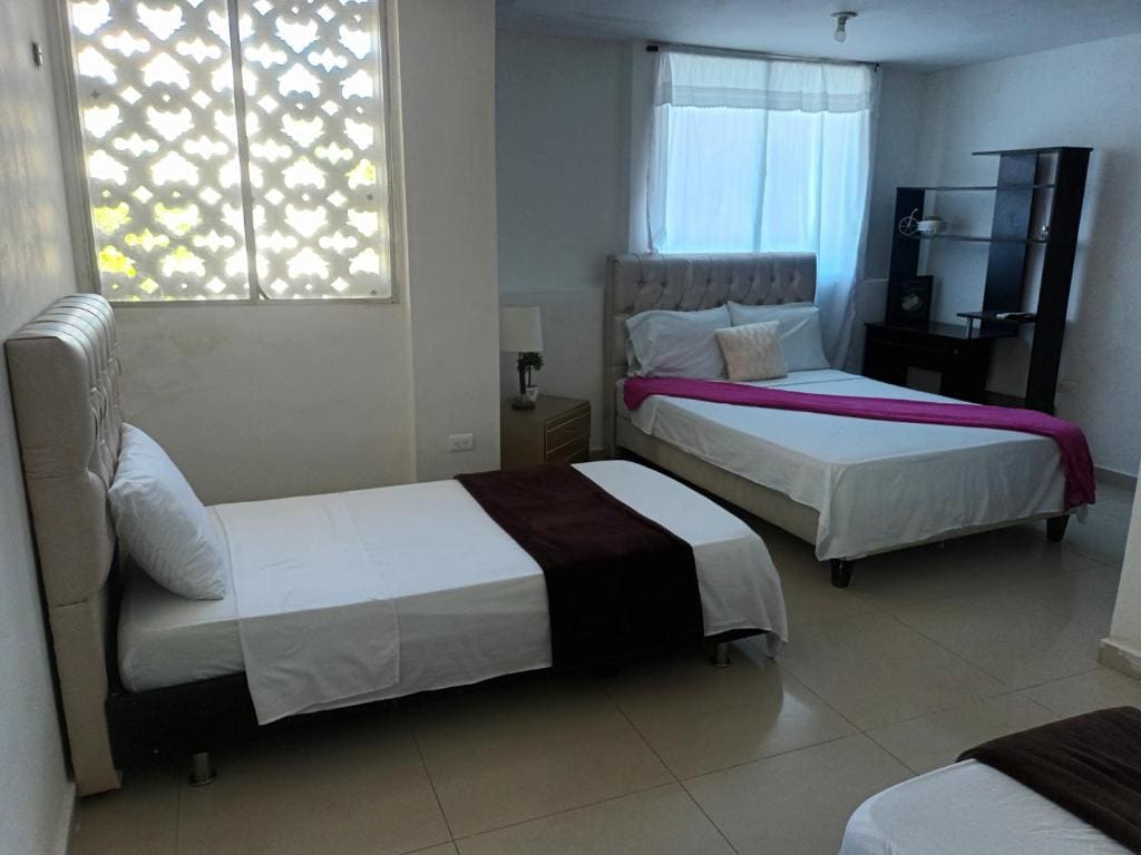 Quadruple Room with Private Bathroom room - Image 1