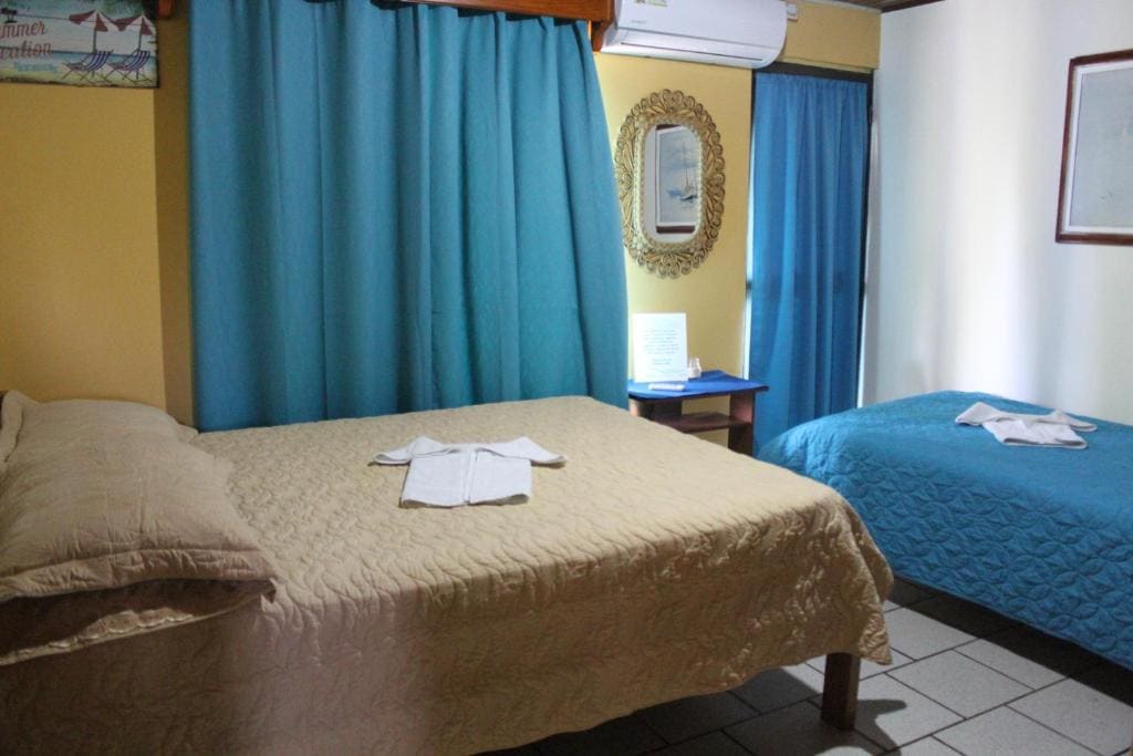 Economy Triple Room with Shared Bathroom room - Image 1