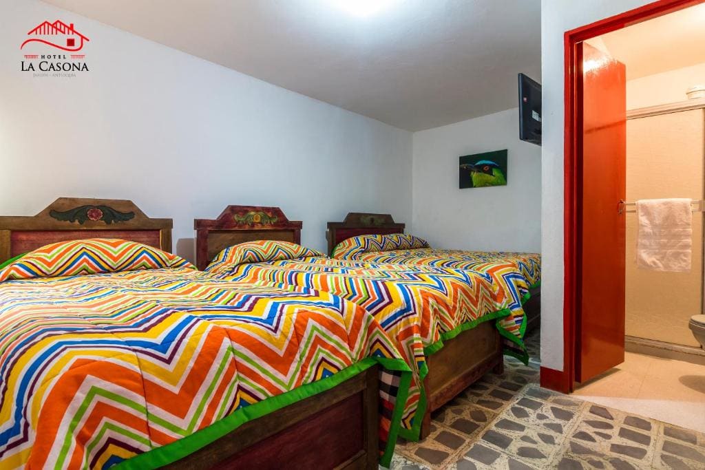 Quadruple Room with Private Bathroom room - Image 1