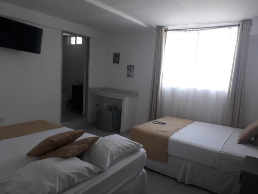 Deluxe Queen Room with Two Queen Beds room - Image 3