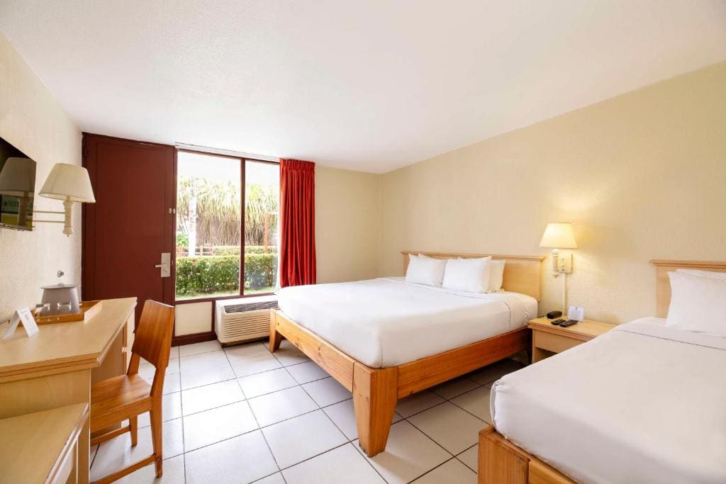 Room with One Double and One Single Bed and Garden View - Non-Smoking room - Image 1