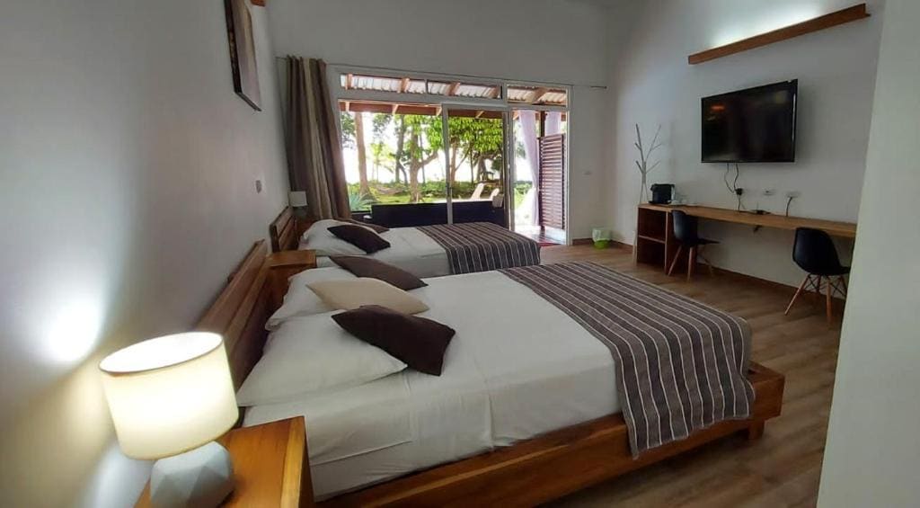 Deluxe Queen Room with Two Queen Beds room - Image 1