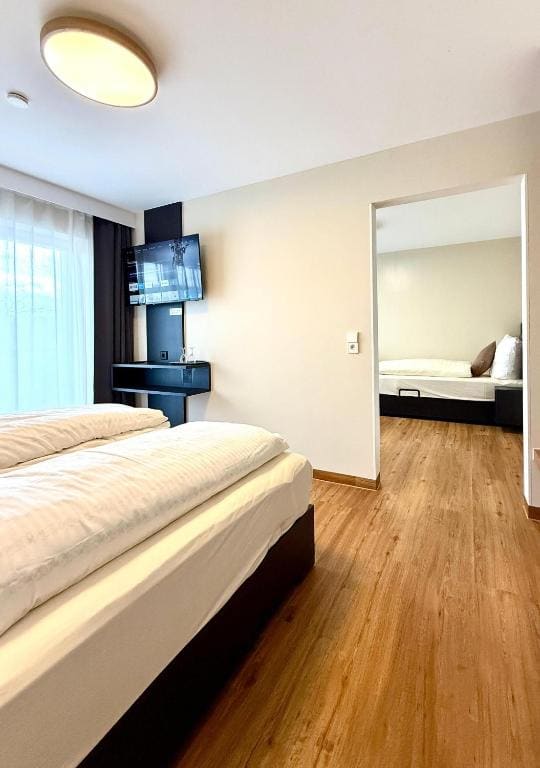 Quadruple Room with Private Bathroom room - Image 1