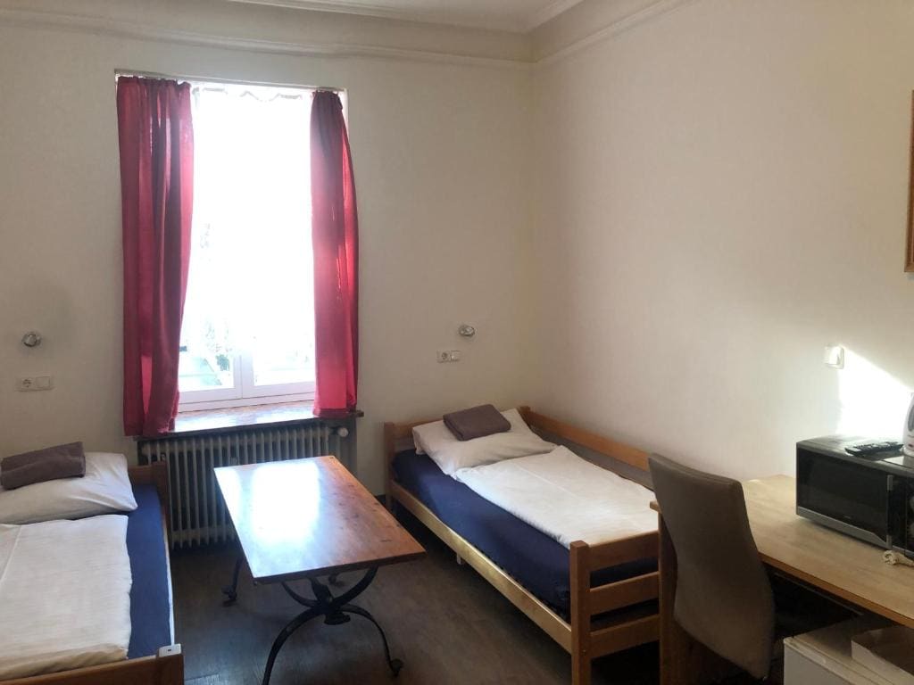 Triple Room with shared toilet and shower room - Image 1