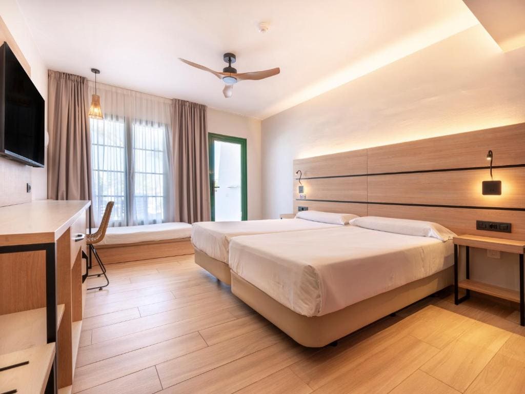 Superior Triple Room with pool view room - Image 1