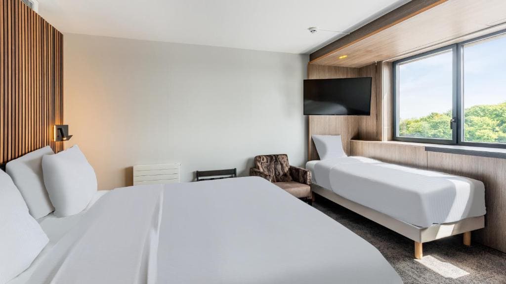 Triple Superior Room with One Queen Bed and One Single Bed room - Image 1