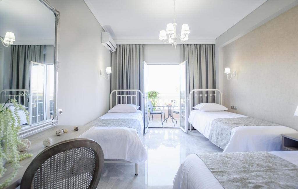 Superior Triple Room with Side Sea View room - Image 1