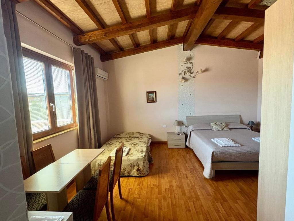 Quadruple Room with Private Bathroom room - Image 1