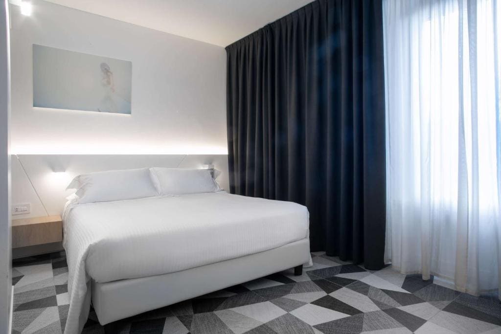 Deluxe Room with One Queen Bed and One Single Bed room - Image 1