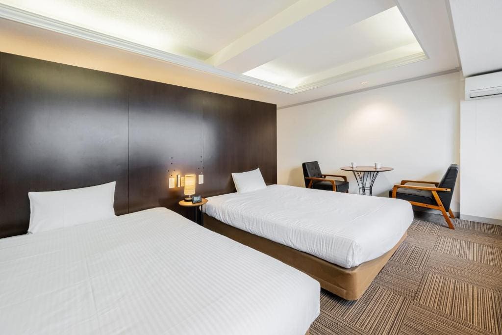 Deluxe Queen Room with Two Queen Beds room - Image 2