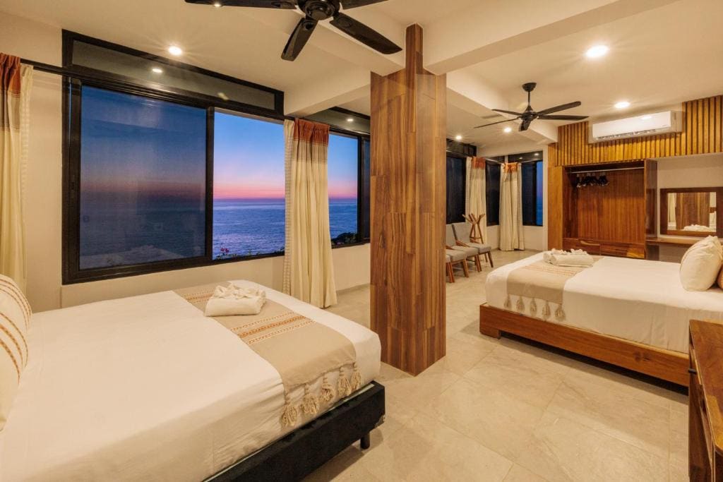 Deluxe Queen Room with Two Queen Beds room - Image 1