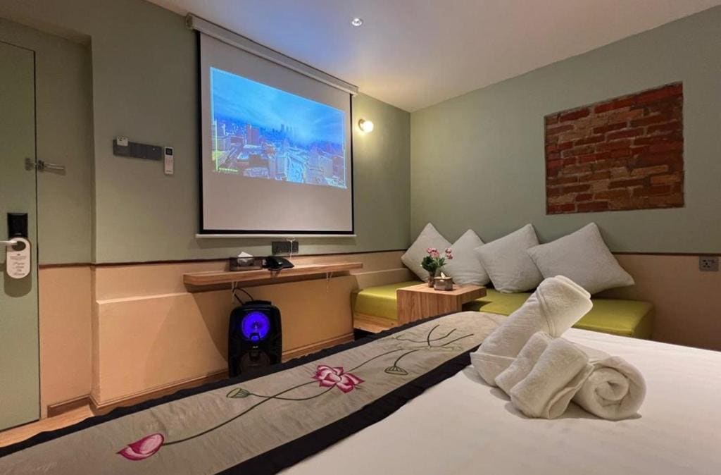 Premier Deluxe King with Sofa Bed and Karaoke Speaker room - Image 1