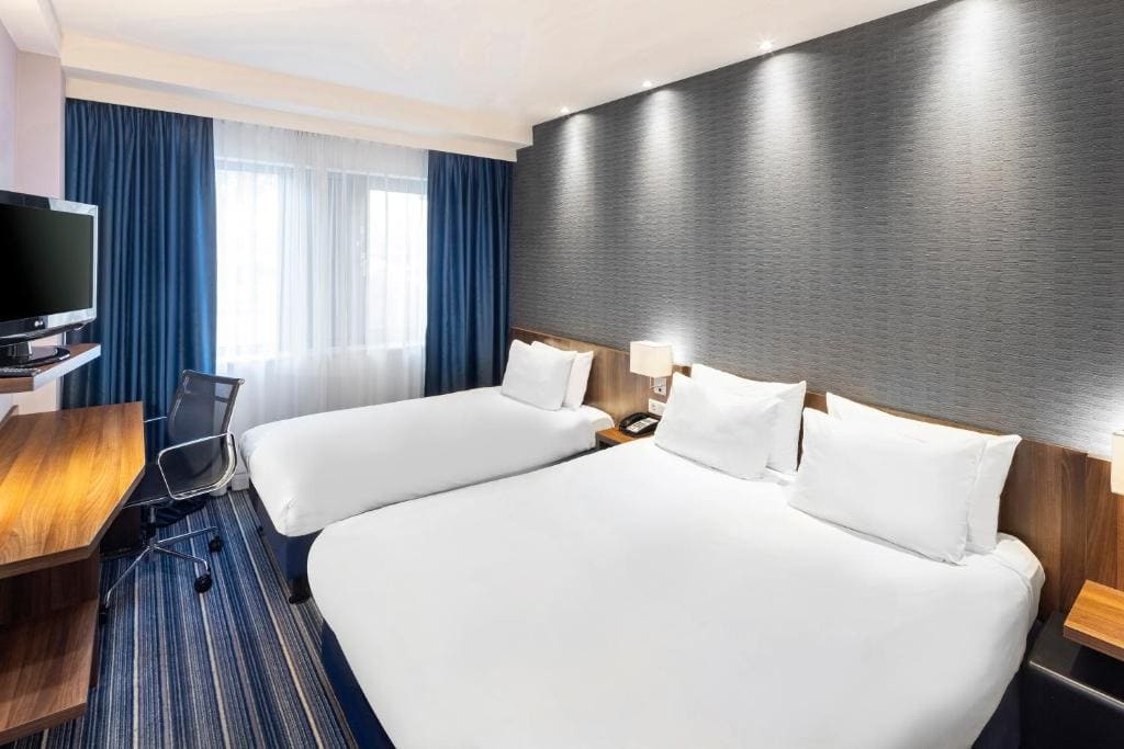 Standard Double Room with One Double Bed and One Single Bed room - Image 1