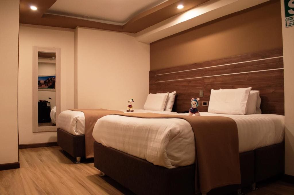 Deluxe Queen Room with Two Queen Beds room - Image 3