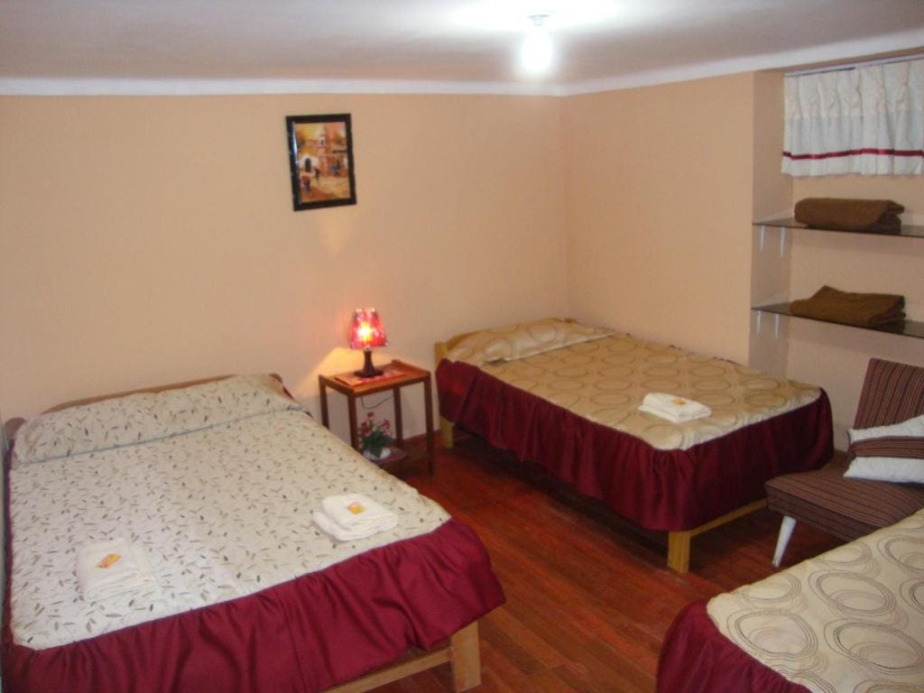 Economy Triple Room with Shared Bathroom room - Image 1
