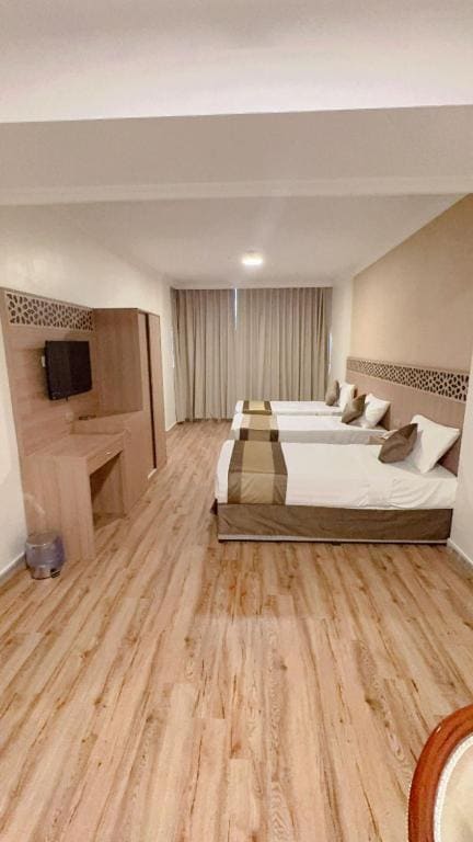 Quadruple Room with Private Bathroom room - Image 2