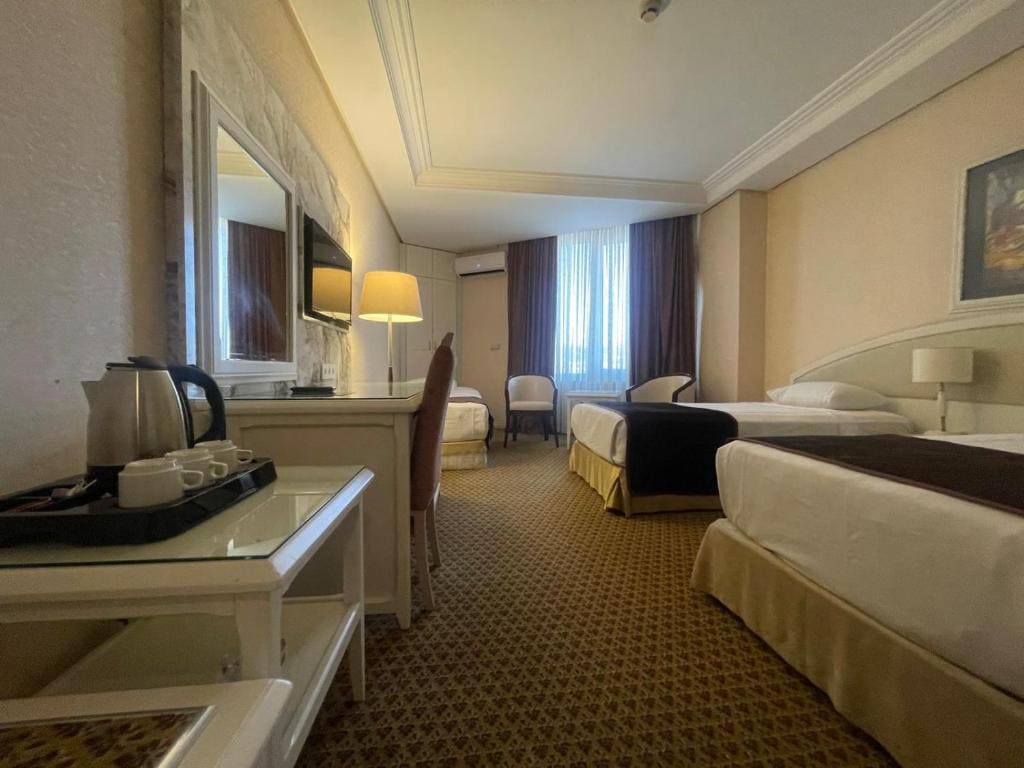 Standard Triple Room with Sea View room - Image 1