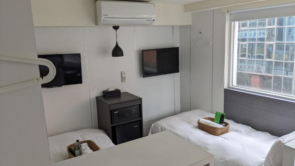 Female Deluxe Twin Room with Shared Bathroom and Toilet room - Image 3