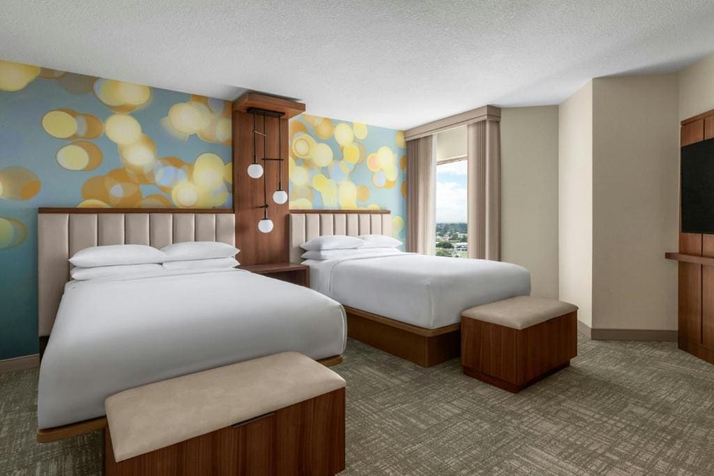 Queen Suite with Two Queen Beds and Sofa Bed room - Image 1