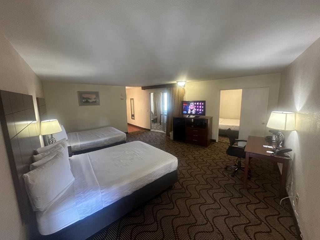 Suite with Three Queen beds room - Image 1
