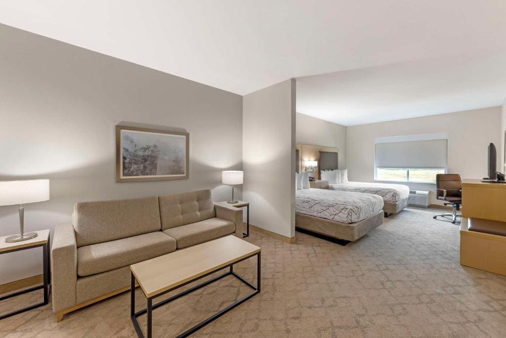 Queen Suite with Two Queen Beds and Sofa Bed room - Image 1