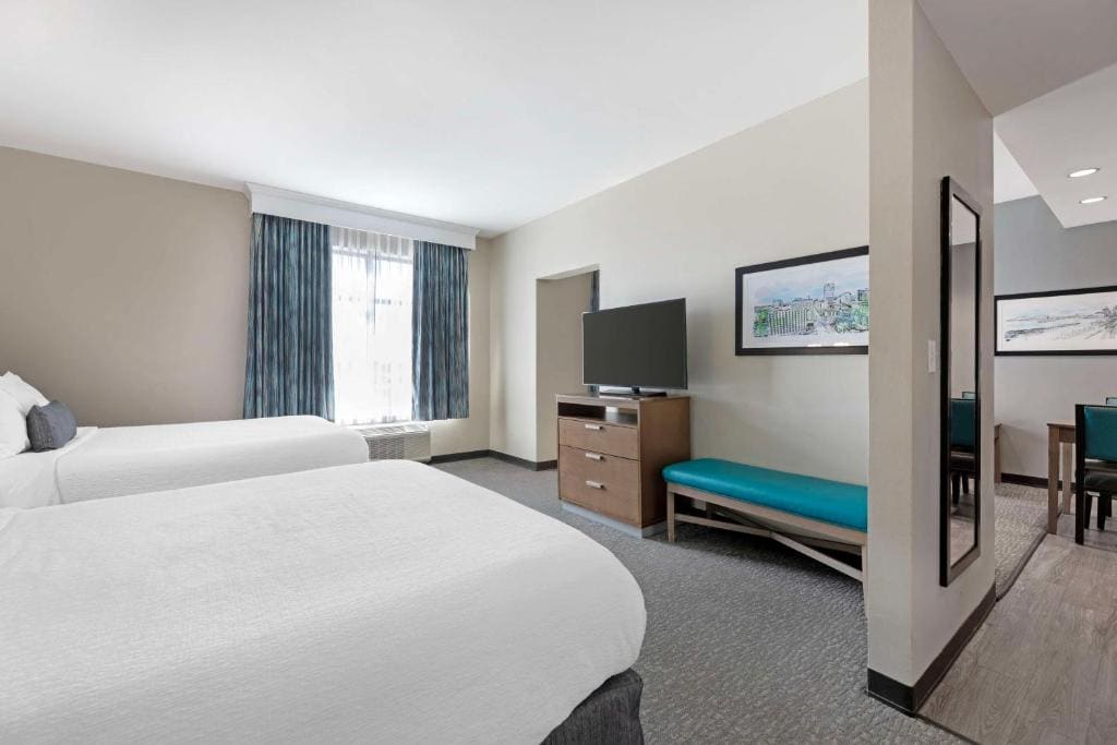 Queen Suite with Two Queen Beds with Sofa Bed room - Image 1