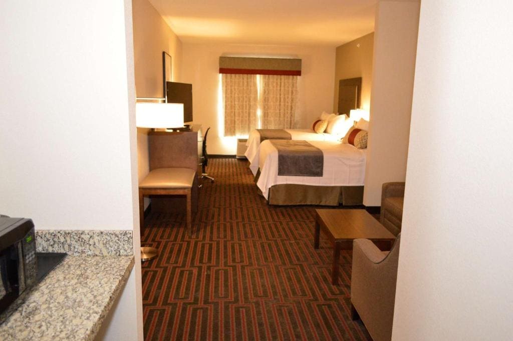 Queen Suite with Two Queen Beds and Sofa Bed room - Image 1