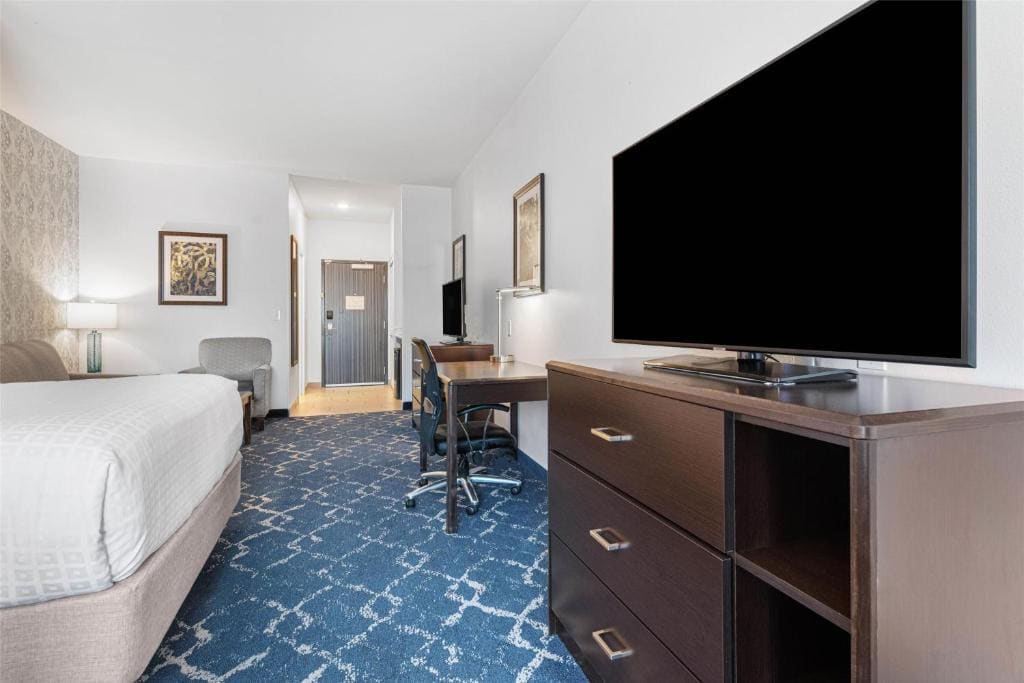 Queen Suite with Two Queen Beds with Sofa Bed room - Image 1