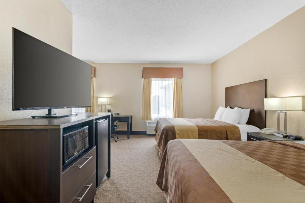 Queen Suite with Two Queen Beds and Sofa Bed room - Image 2