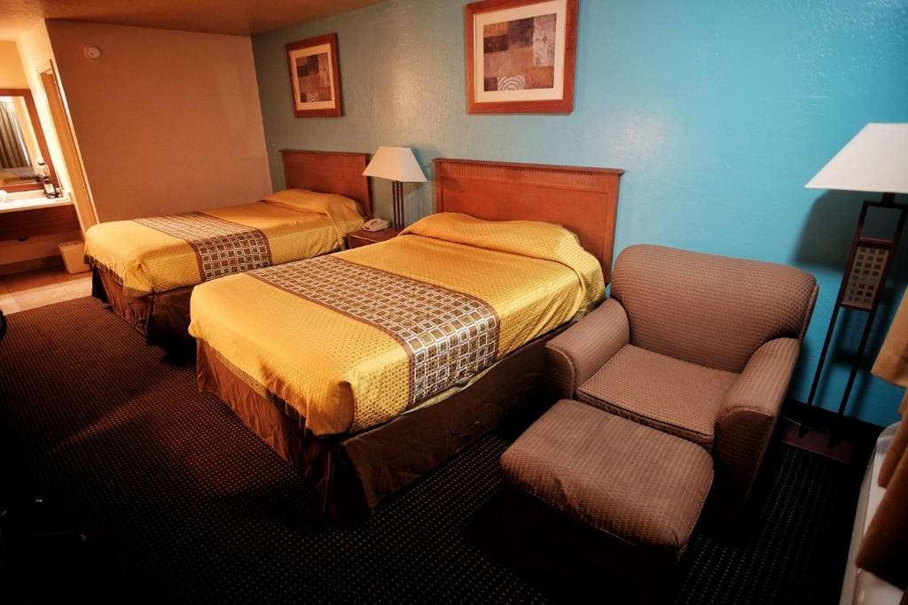 Deluxe Queen Room with Two Queen Beds room - Image 1