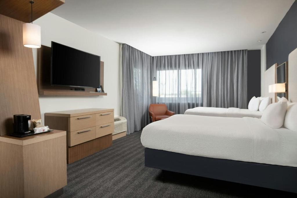 Studio with Two Queen Beds and Sofa Bed room - Image 3