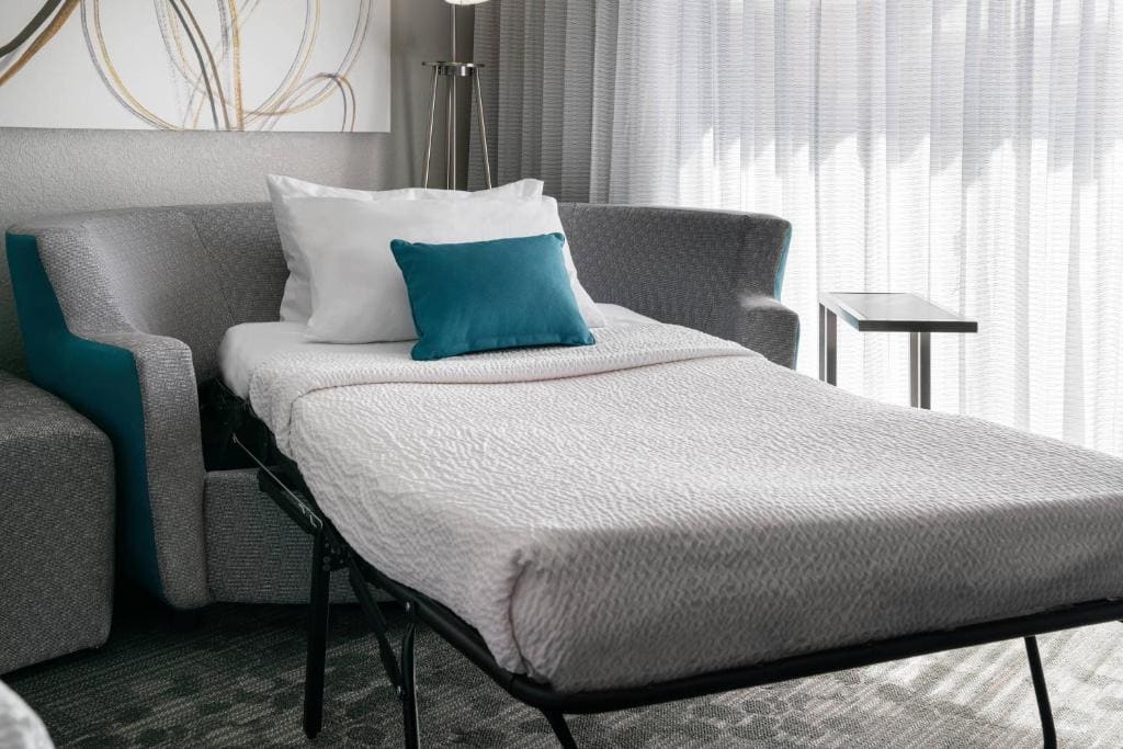 Queen Suite with Two Queen Beds and Sofa Bed room - Image 1