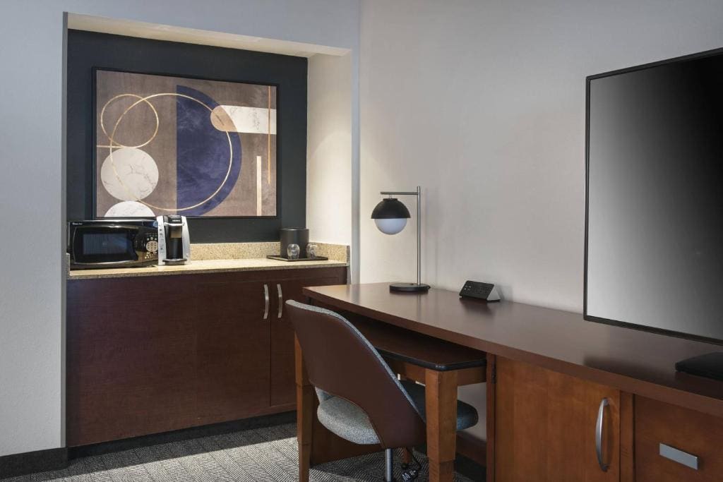 One-Bedroom Suite with Two Double Beds and Sofa Bed room - Image 2
