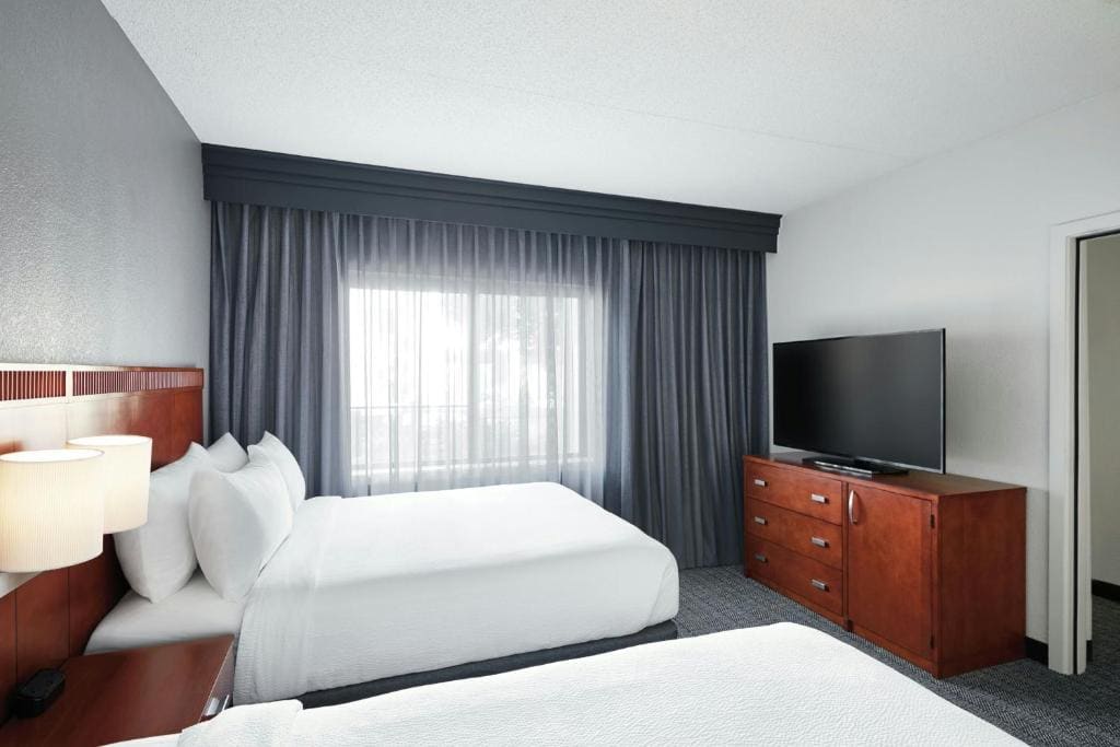 One-Bedroom Suite with Two Queen Beds and Sofa Bed room - Image 1