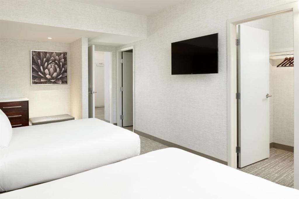 Premium Suite with Two Queen Beds and Sofa Sleeper - Living Room room - Image 1