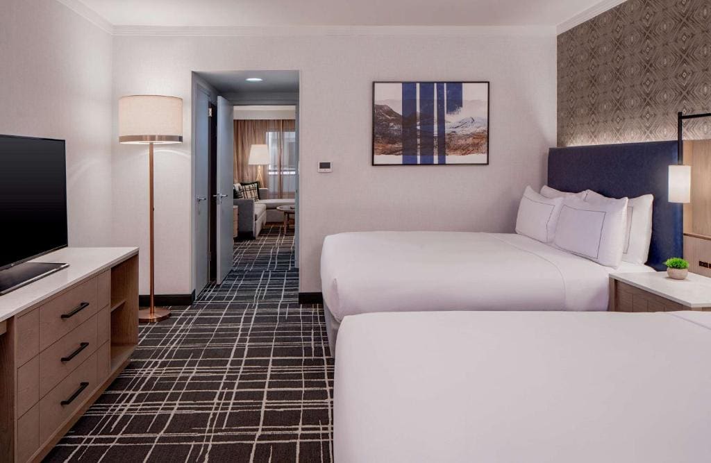 One-Bedroom Queen Suite with Two Queen Beds and Sofa Bed room - Image 1